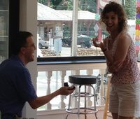 John brought Meredith back to the ice cream shop of their first date and stunned her with a ring. 
