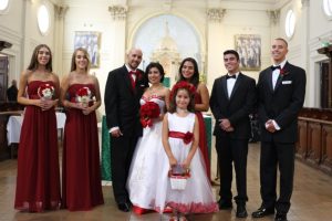 Image of Claudia and Donald with their children at their wedding