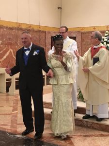 Image of Fidelia and William beaming after the sacrament of marriage