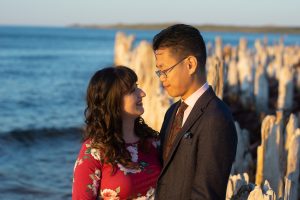 Image of Shelyse and Brandan looking at each other in front of water