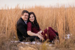 Image of Matthew and Alisha dressed up in a meadow.