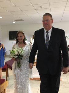 Image of couple leaving their church after getting married