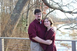 Image of couple on bridge in autumn