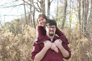 Image of couple near trees smiling