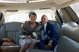 Image of couple in limo on wedding day