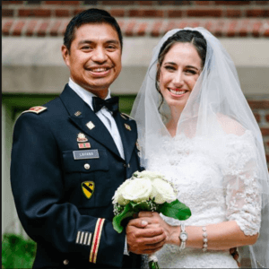 Image of couple smiling on wedding day