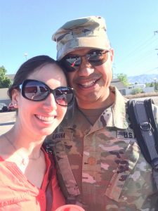 Image of couple in sunglasses, smiling