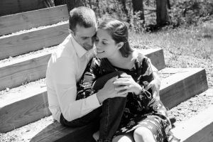 Image of couple in black and white sitting on steps