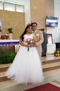 Image of married couple in church on wedding day