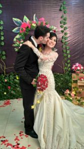 Image of couple embracing on wedding day