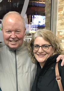 Image of couple smiling at camera
