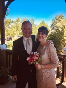 Image of couple smiling at wedding