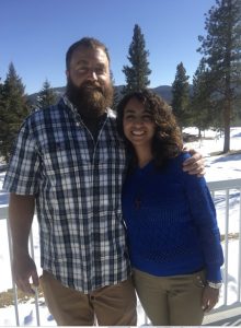 Image of couple standing outside near snow