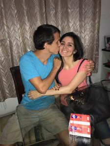 Image of man kissing woman on the cheek