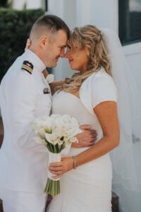 Image of couple embracing in wedding attire