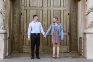 Image of couple holding hands outside church doors