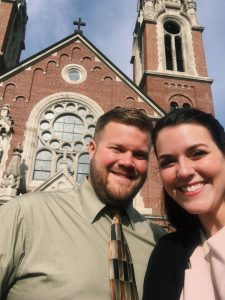 Image of couple standing outside of church