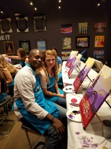Image of couple on a first date at a paint and sip