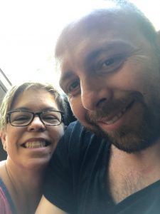 Image of Sheri and Luca smiling at the camera