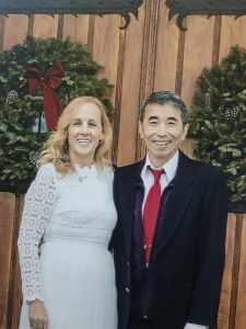 man and woman outside of church