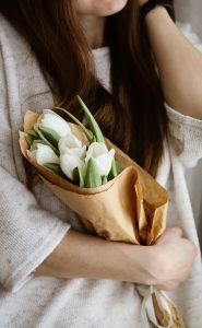 woman holding bouquet of tulips